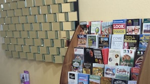 A book display with various travel and local guide books. - Paradise Inn & Suites (Towanda)