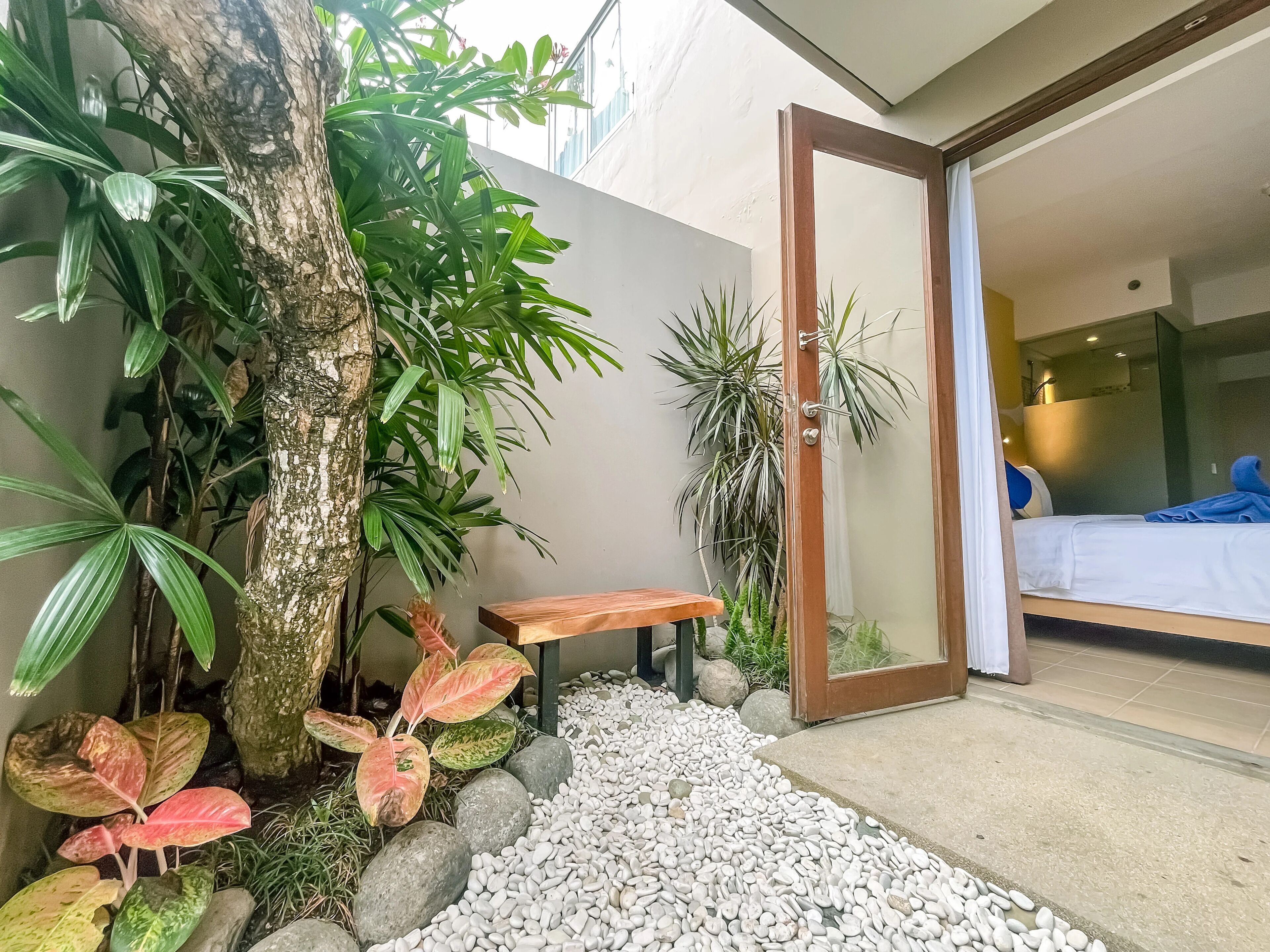 Deluxe Room, Garden View (Free Beer - Welcome Drink) | Minibar, in-room safe, iron/ironing board (on request), WiFi (free)