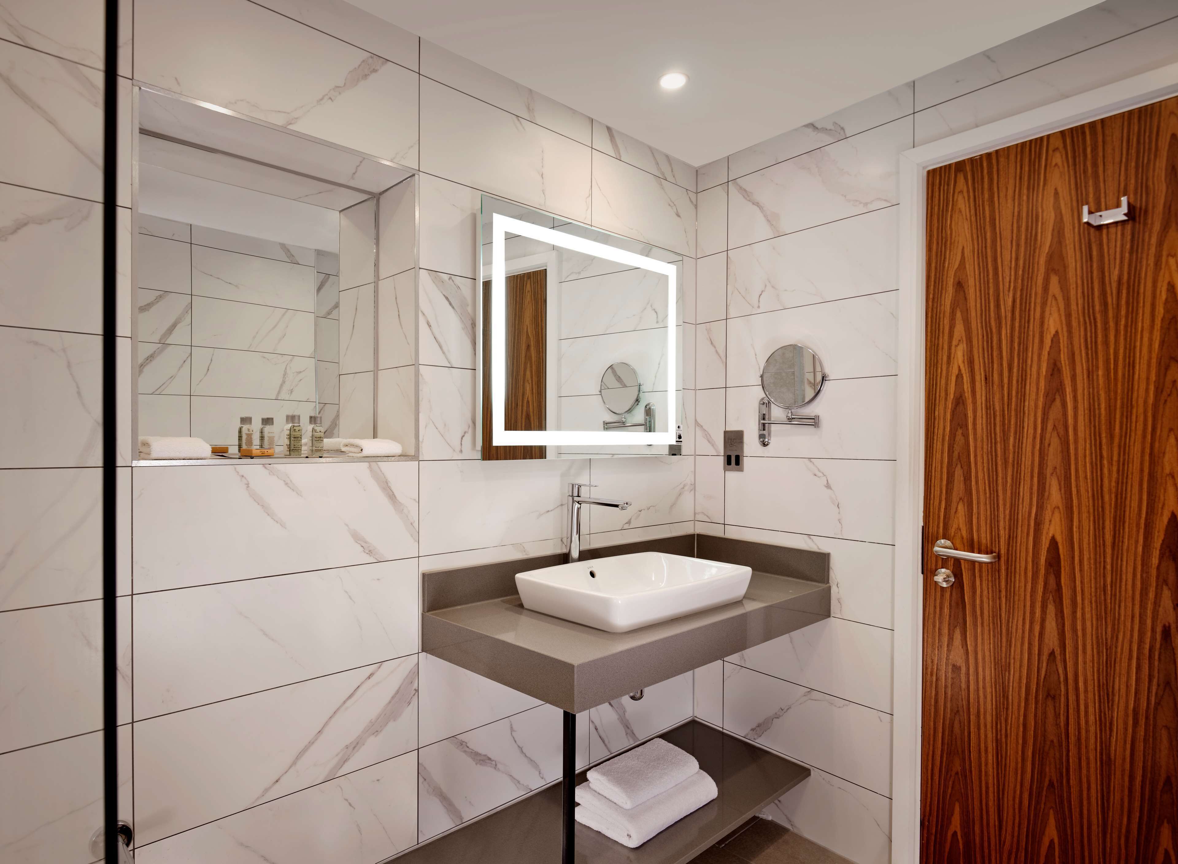 deluxe room, 1 king bed | bathroom | shower, free toiletries, hair dryer, towels