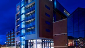 A modern hotel with multiple floors, large windows, and a prominent sign reading "DoubleTree by Hilton". - DoubleTree by Hilton Lincoln (Lincoln)