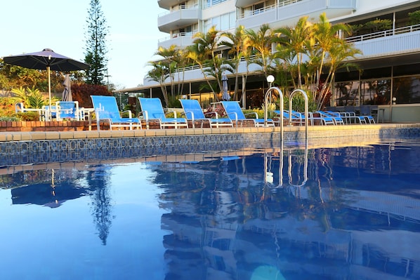 Outdoor pool, open 7:30 AM to 9:30 PM, pool umbrellas, pool loungers