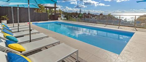 Outdoor pool, open 10:00 AM to 10:00 PM, pool umbrellas, sun loungers