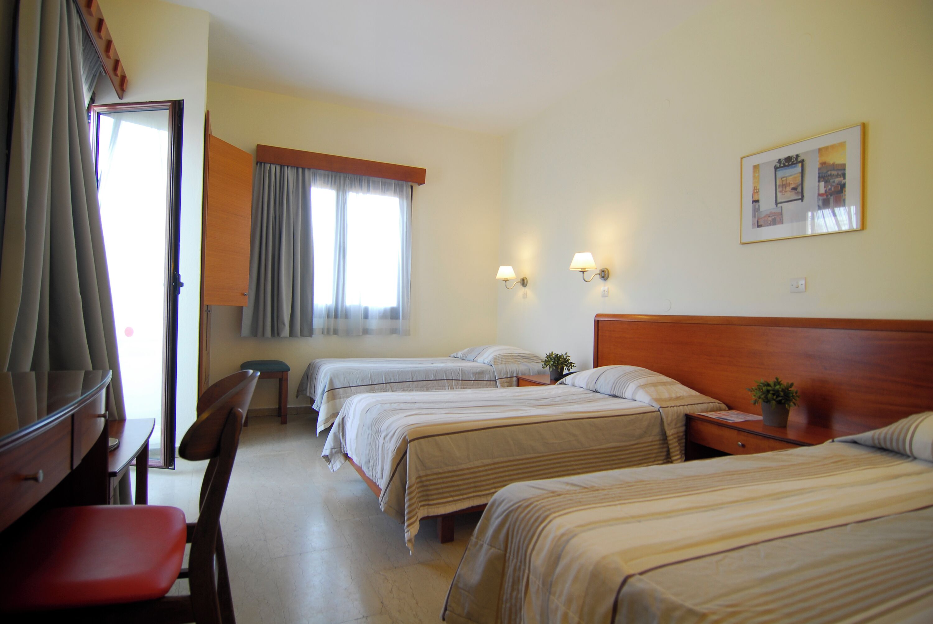 Standard Triple Room | Minibar, in-room safe, iron/ironing board, free WiFi