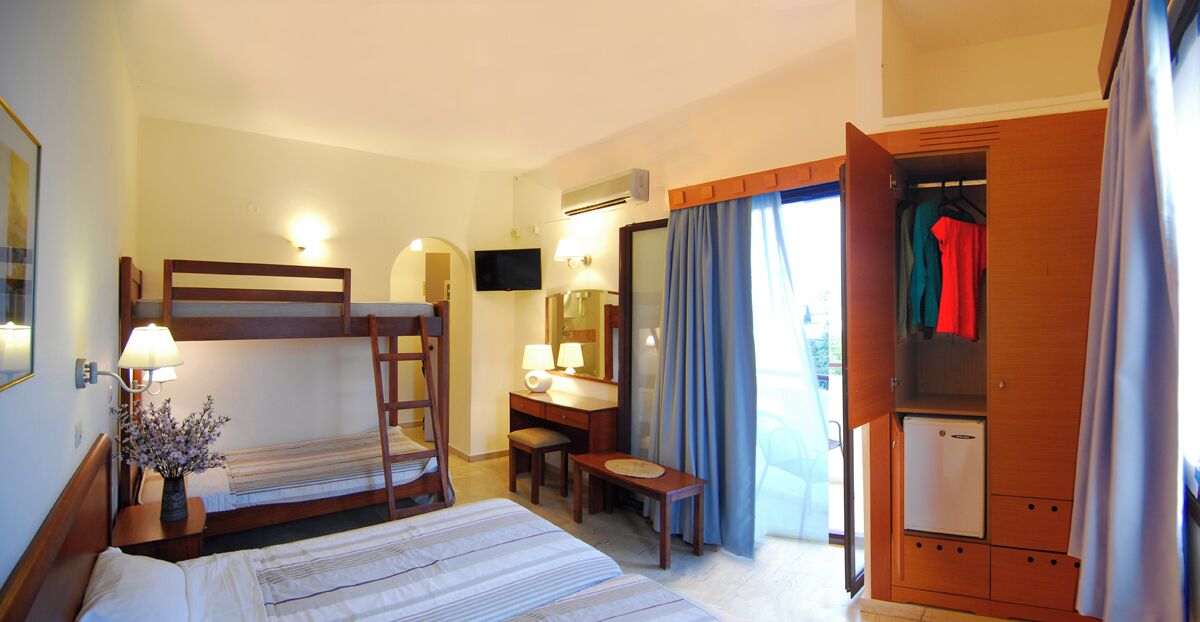 Economy Quadruple Room | Minibar, in-room safe, iron/ironing board, free WiFi