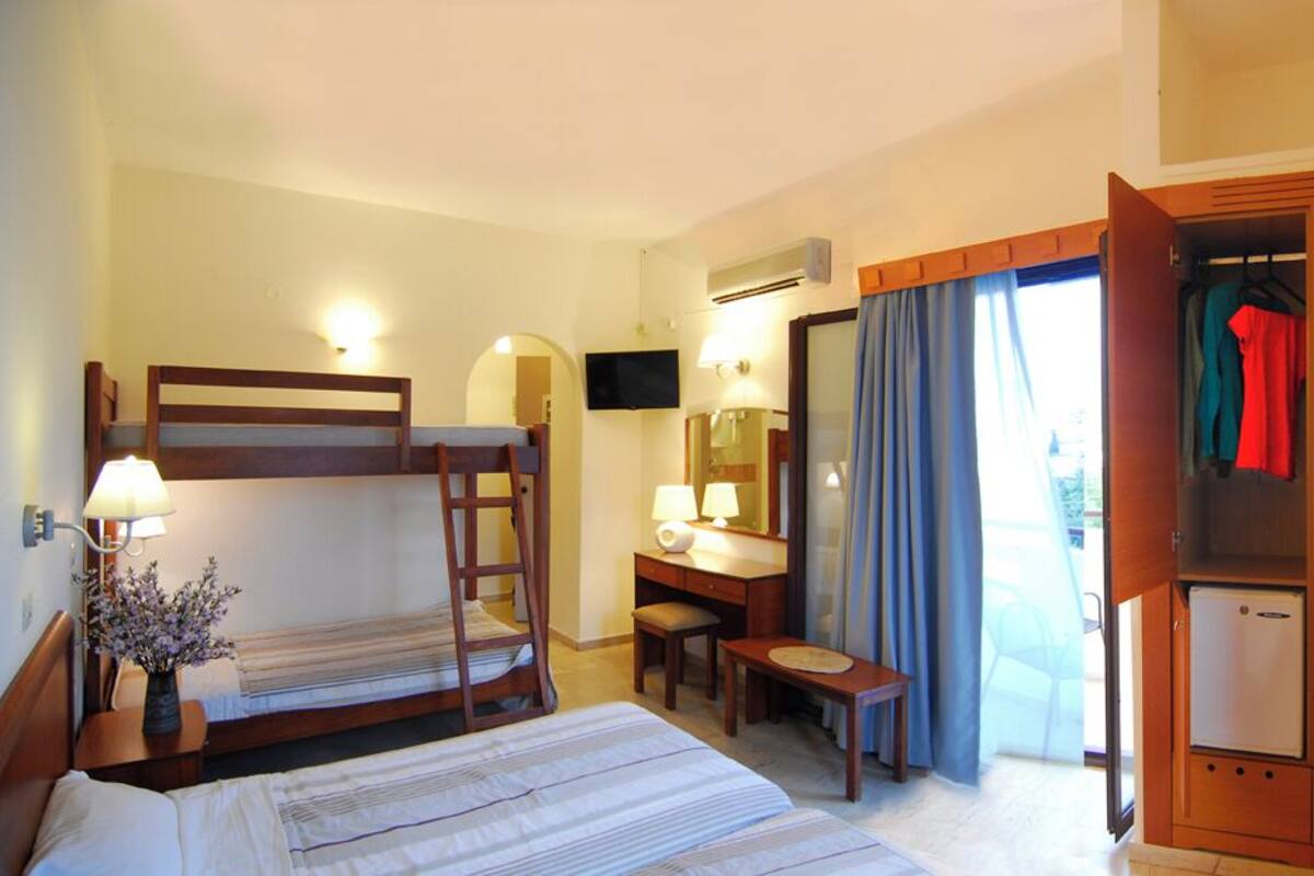 Economy Quadruple Room | Minibar, in-room safe, iron/ironing board, free WiFi