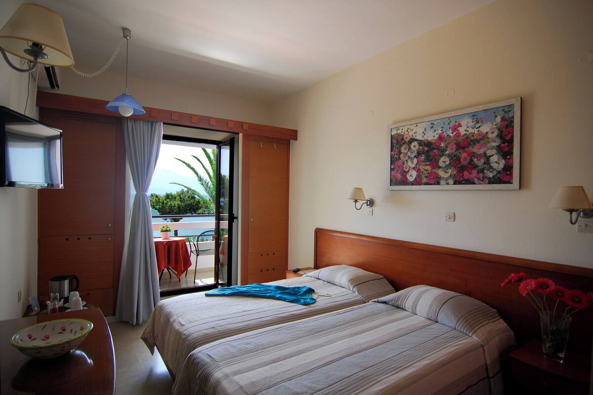 Standard Twin Room, Sea View | Minibar, in-room safe, iron/ironing board, free WiFi