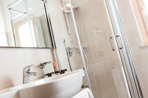 Shower, free toiletries, hair dryer, slippers