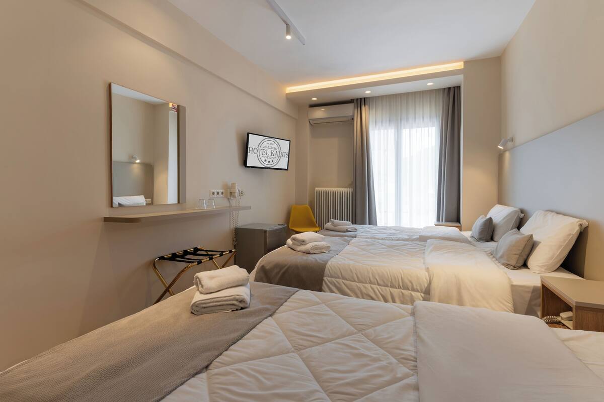 family triple room, 3 single beds, non smoking, mountain view | in-room safe, soundproofing, iron/ironing board, free wifi