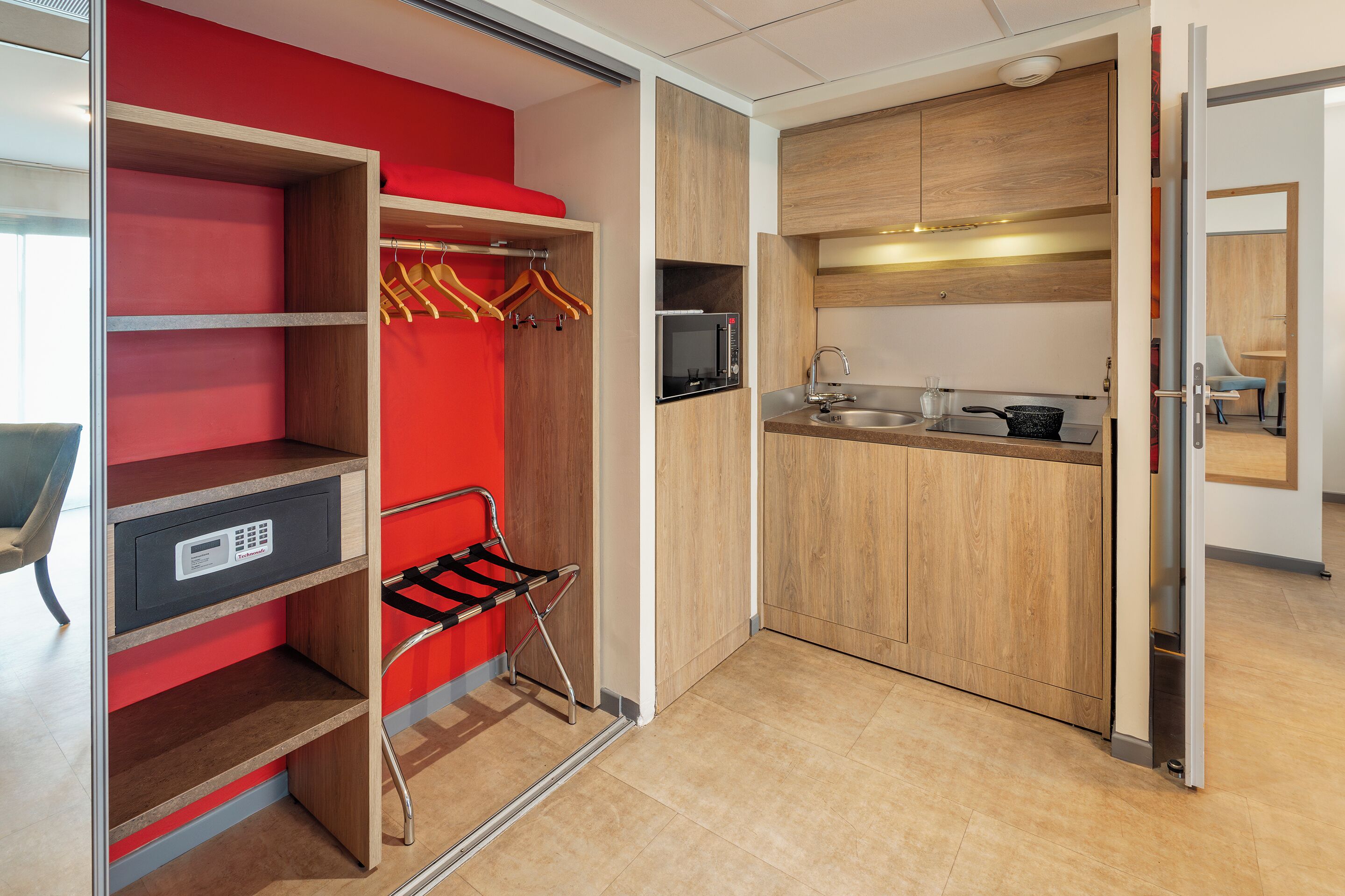 A modern kitchen with a microwave, sink, and stove.