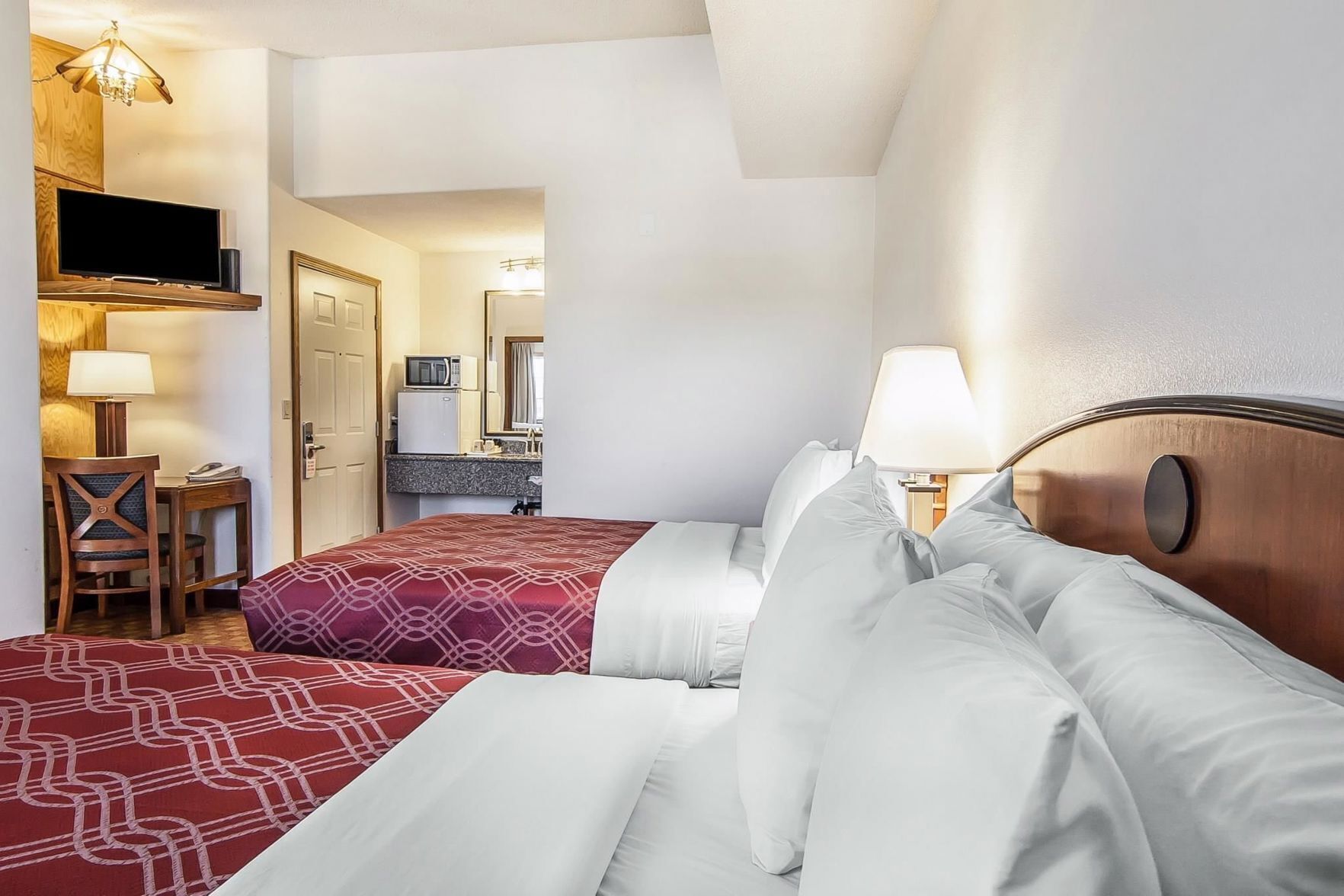 Hypo-allergenic bedding, desk, laptop workspace, blackout curtains