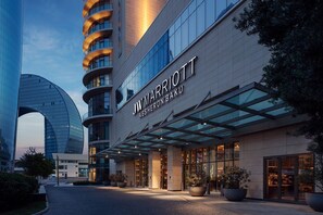 JW Marriott Absheron Baku hotel with a modern facade, large glass windows, and a well-lit entrance. - JW Marriott Absheron Baku (Baku)