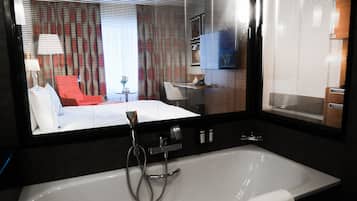 Deluxe Room, 1 King Bed | Bathroom | Shower, rainfall showerhead, designer toiletries, hair dryer
