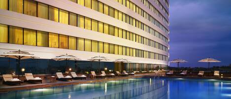 Outdoor pool, open 6:00 AM to 8:00 PM, pool umbrellas, pool loungers