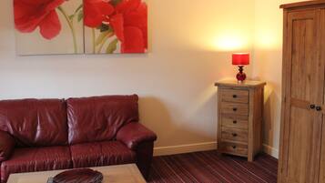 Chambre Deluxe, 1 trĂšs grand lit | Bureau, fer et planche Ă repasser, Wi-Fi gratuit