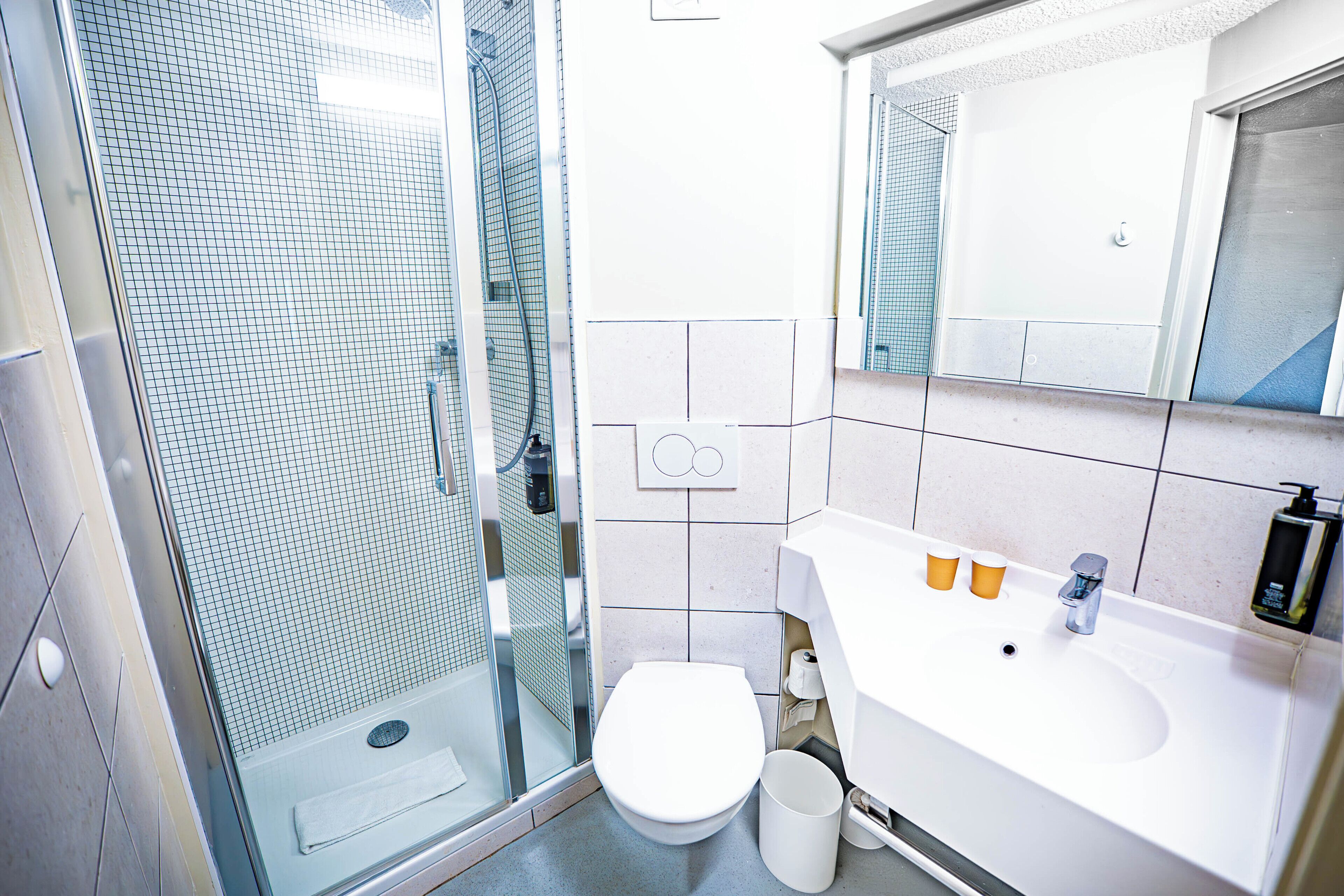 Shower, eco-friendly toiletries, hair dryer, towels