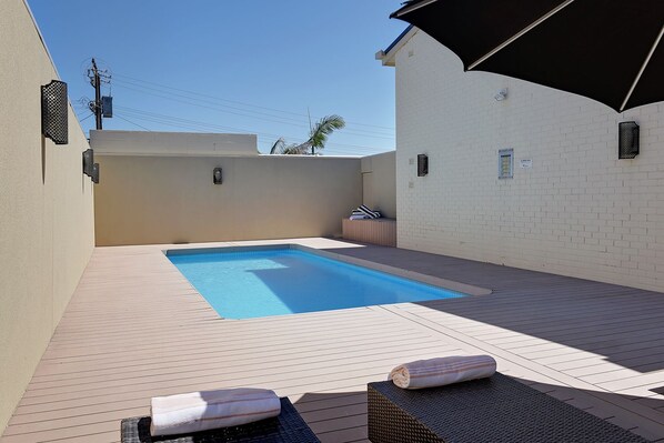 Outdoor pool, pool umbrellas, pool loungers