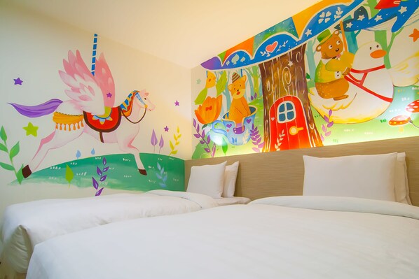A hotel room with a large bed, two pillows, and a colorful mural on the wall depicting animals and a house. - Legend Hotel Liuhe (Kaohsiung)
