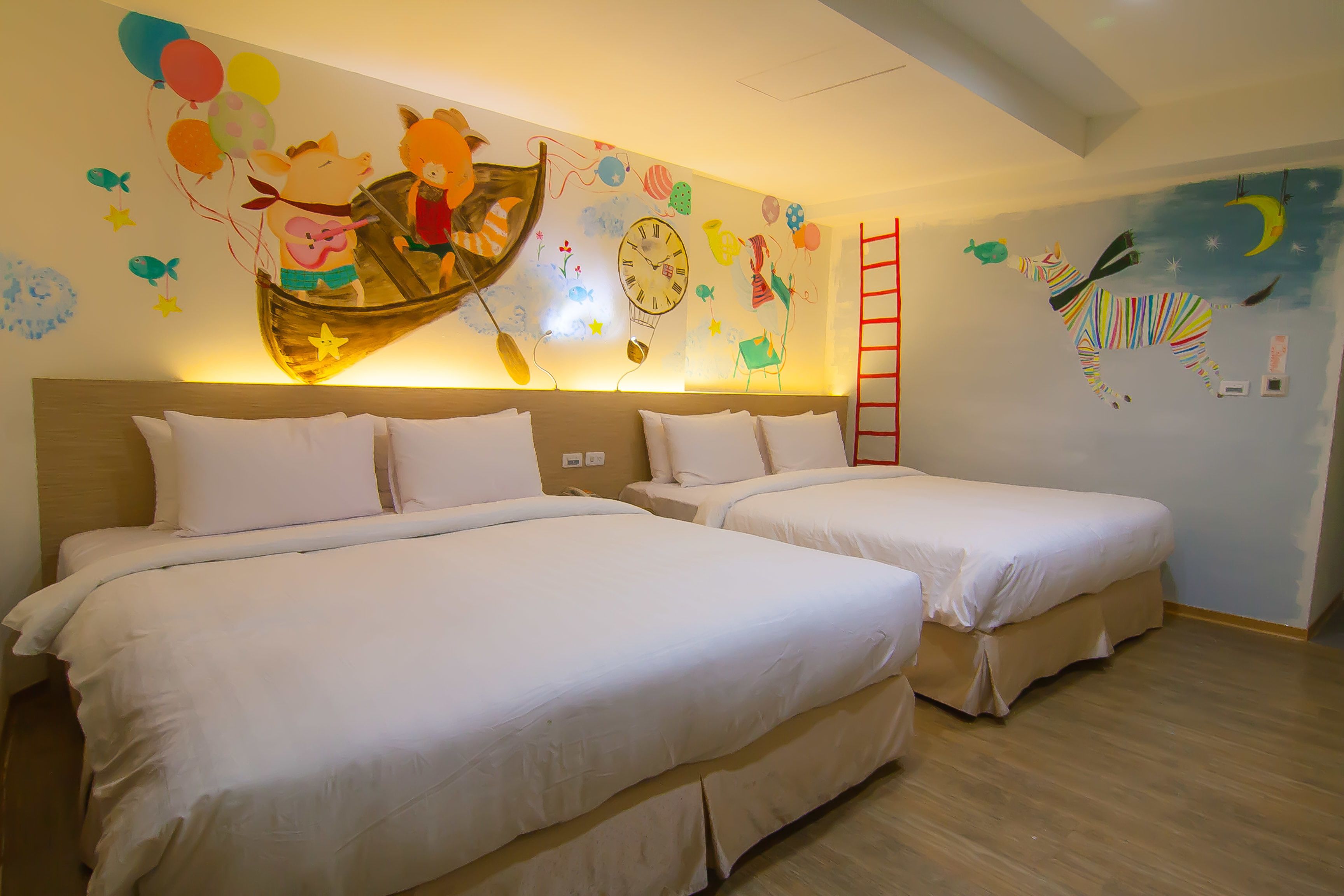 deluxe quadruple room, 2 queen beds | down duvets, minibar, in-room safe, individually decorated