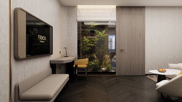 A modern interior with a bench, a small table, a chair, and a wall-mounted TV. - voco Suites Shenzhen Huanggang by IHG (Shenzhen)