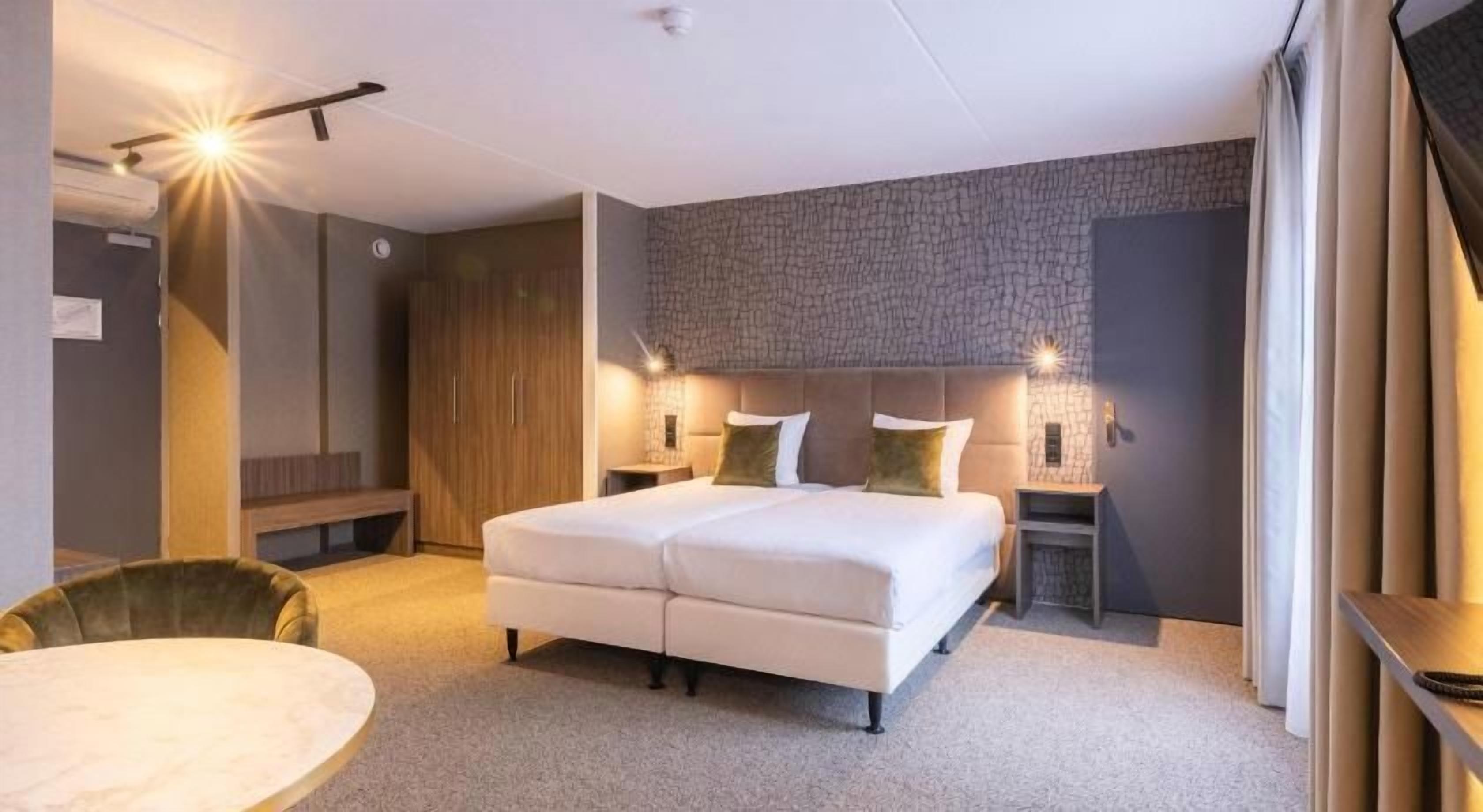 Hypo-allergenic bedding, laptop workspace, blackout drapes