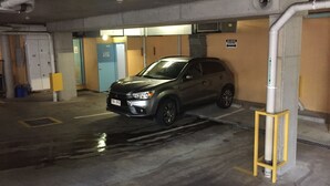 A parking garage with a car parked in a spot. - Silkari The Pavilions Port Douglas (Port Douglas)
