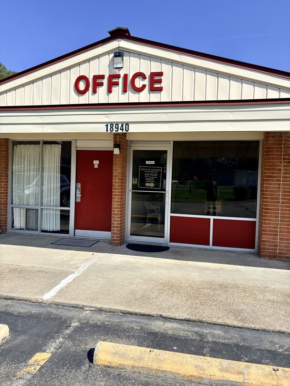 A building with a sign reading 'OFFICE' and the number '18940' above the entrance.