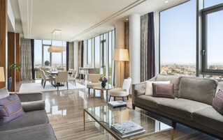 Astor Suite, 1 King Bed, Balcony, Tower | Living area | 40-inch LCD TV with digital channels, TV, books