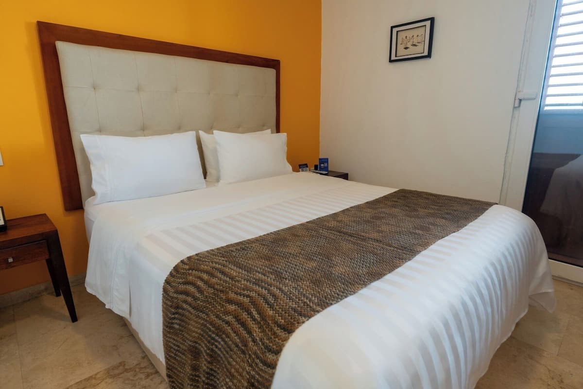 Premium bedding, down comforters, minibar, in-room safe