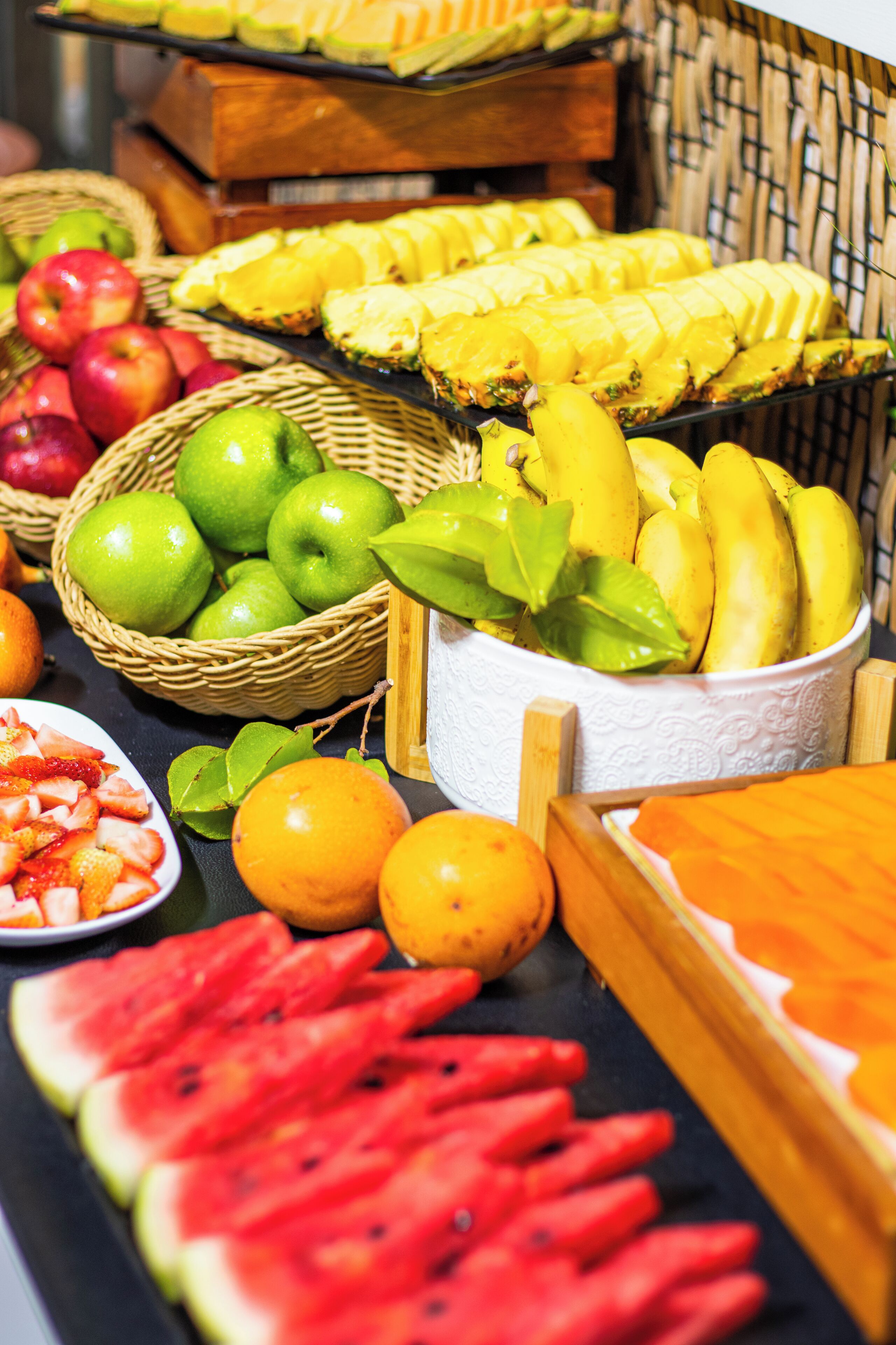 A variety of fruits including apples, bananas, and watermelon slices.