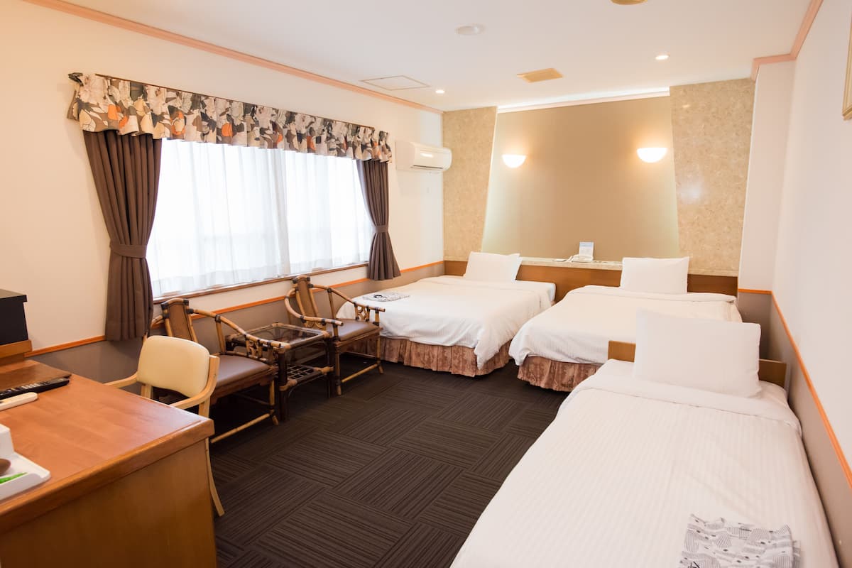 Triple Room, Multiple Beds, Non Smoking | Down duvets, desk, laptop workspace, blackout curtains