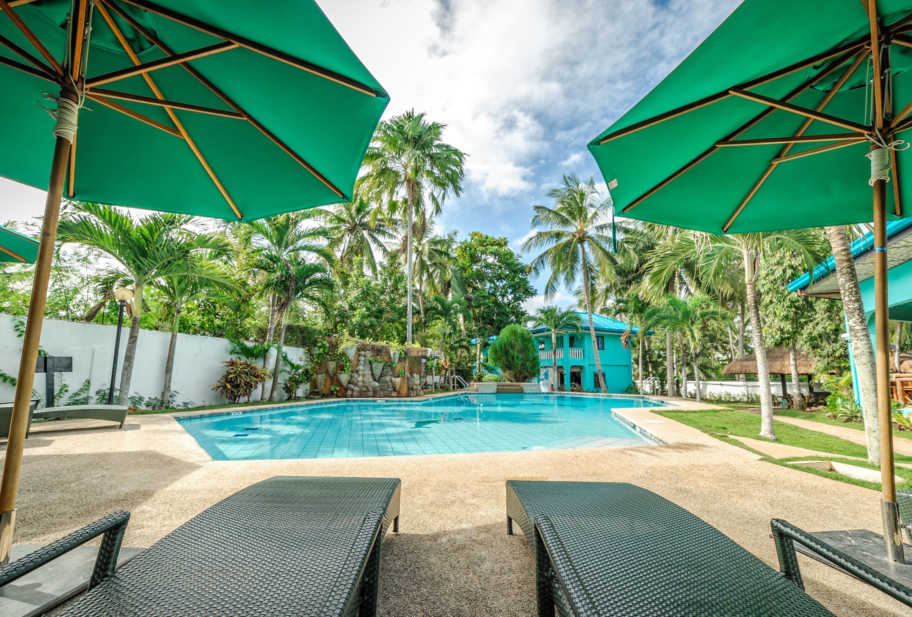 outdoor pool, pool umbrellas, pool loungers