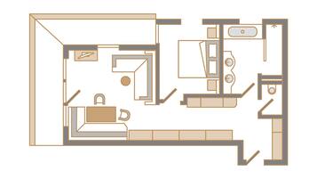 A floor plan of a hotel room with a bed, a desk, a chair, a bathroom, and a small sitting area.