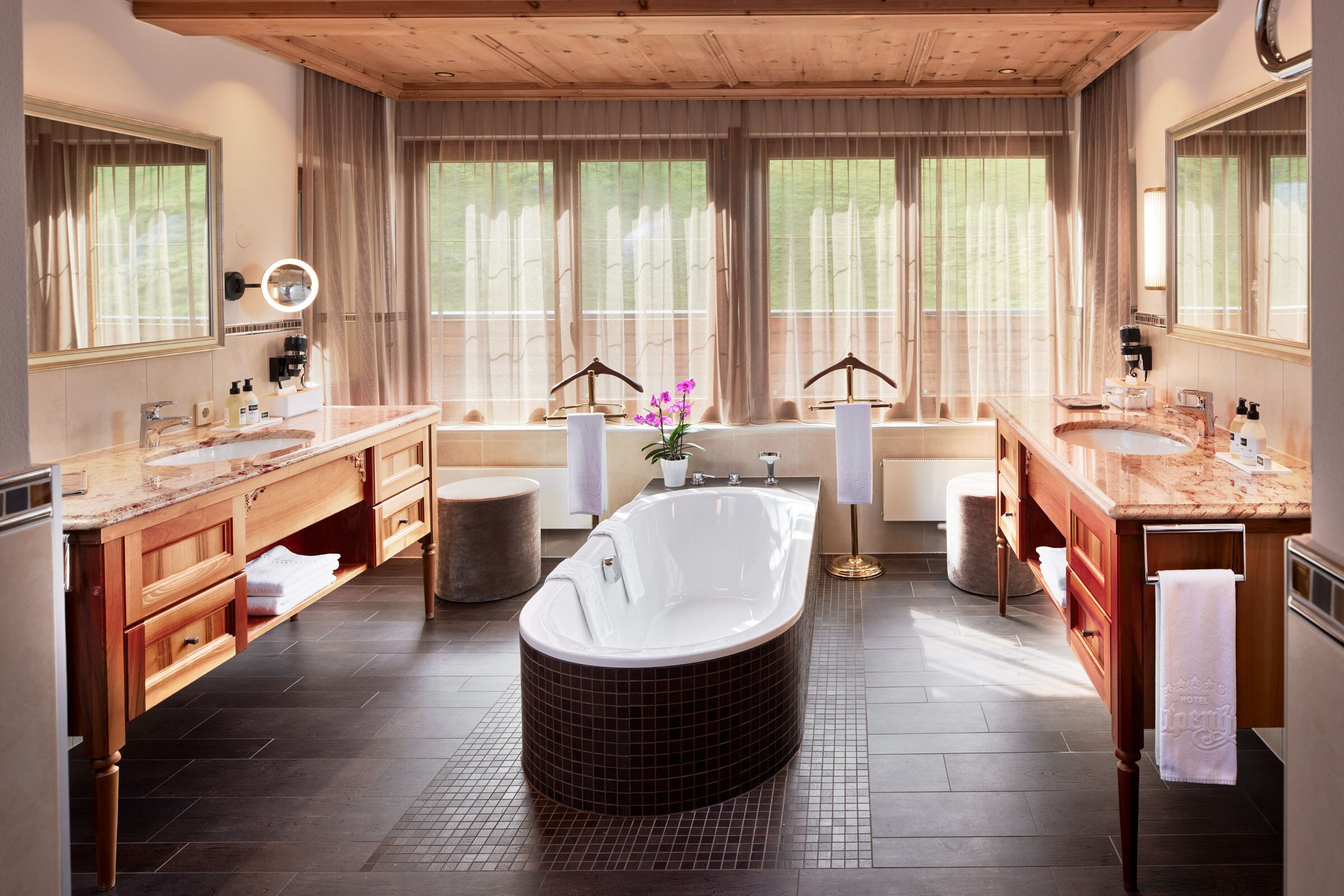 suite, balcony, mountain view (alpenhof) | bathroom | free toiletries, hair dryer, bathrobes, slippers