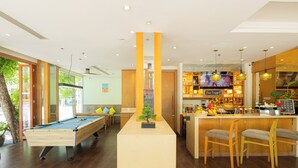 A pool table, bar area, and seating in a modern indoor space. - ASHLEE Plaza Patong Hotel & Spa (Patong)