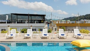 A rooftop pool area with lounge chairs and a view of the cityscape. - ASHLEE Plaza Patong Hotel & Spa (Patong)