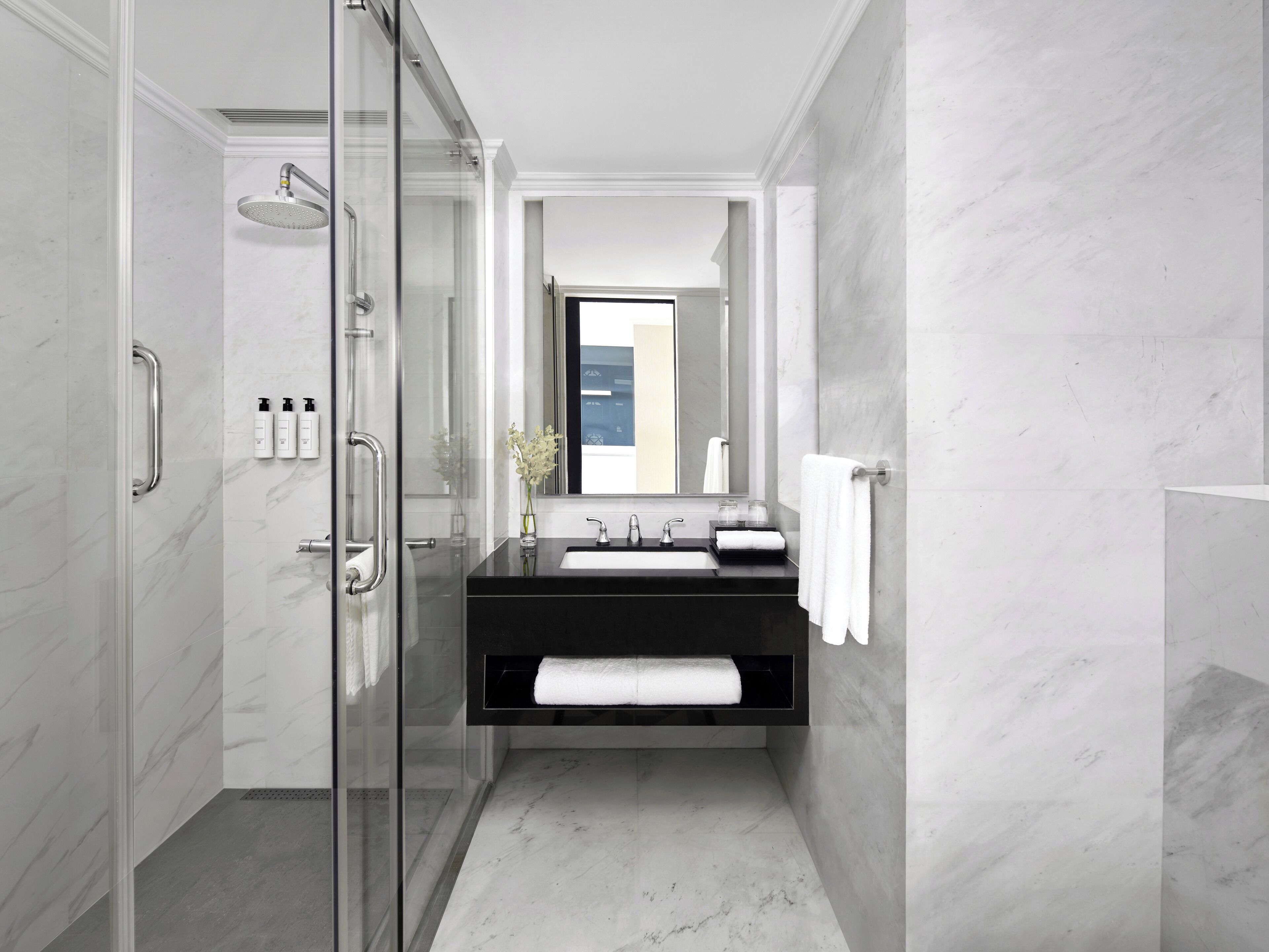 designer toiletries, hair dryer, bathrobes, slippers