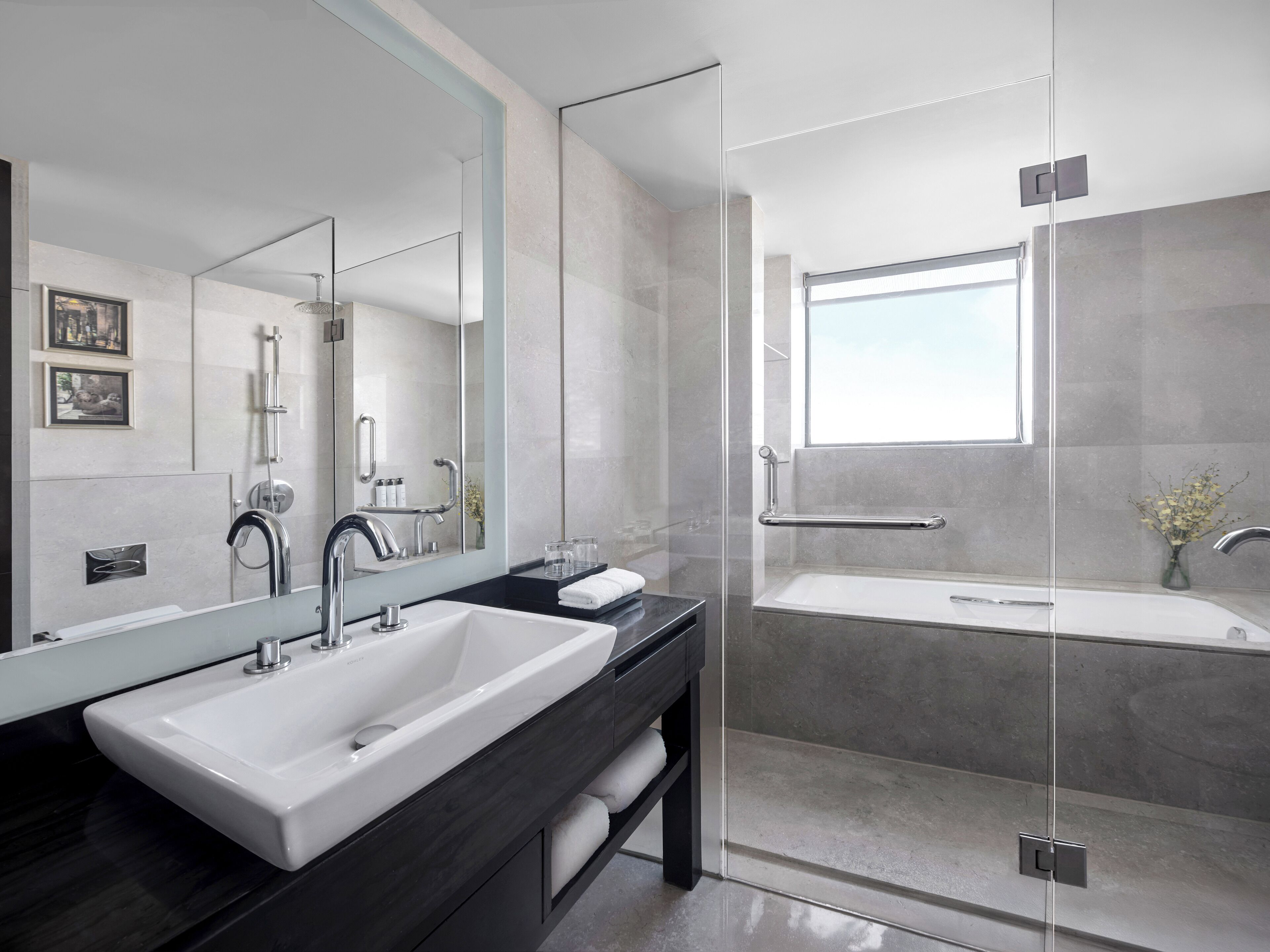 1 bedroom suite | bathroom | designer toiletries, hair dryer, bathrobes, slippers