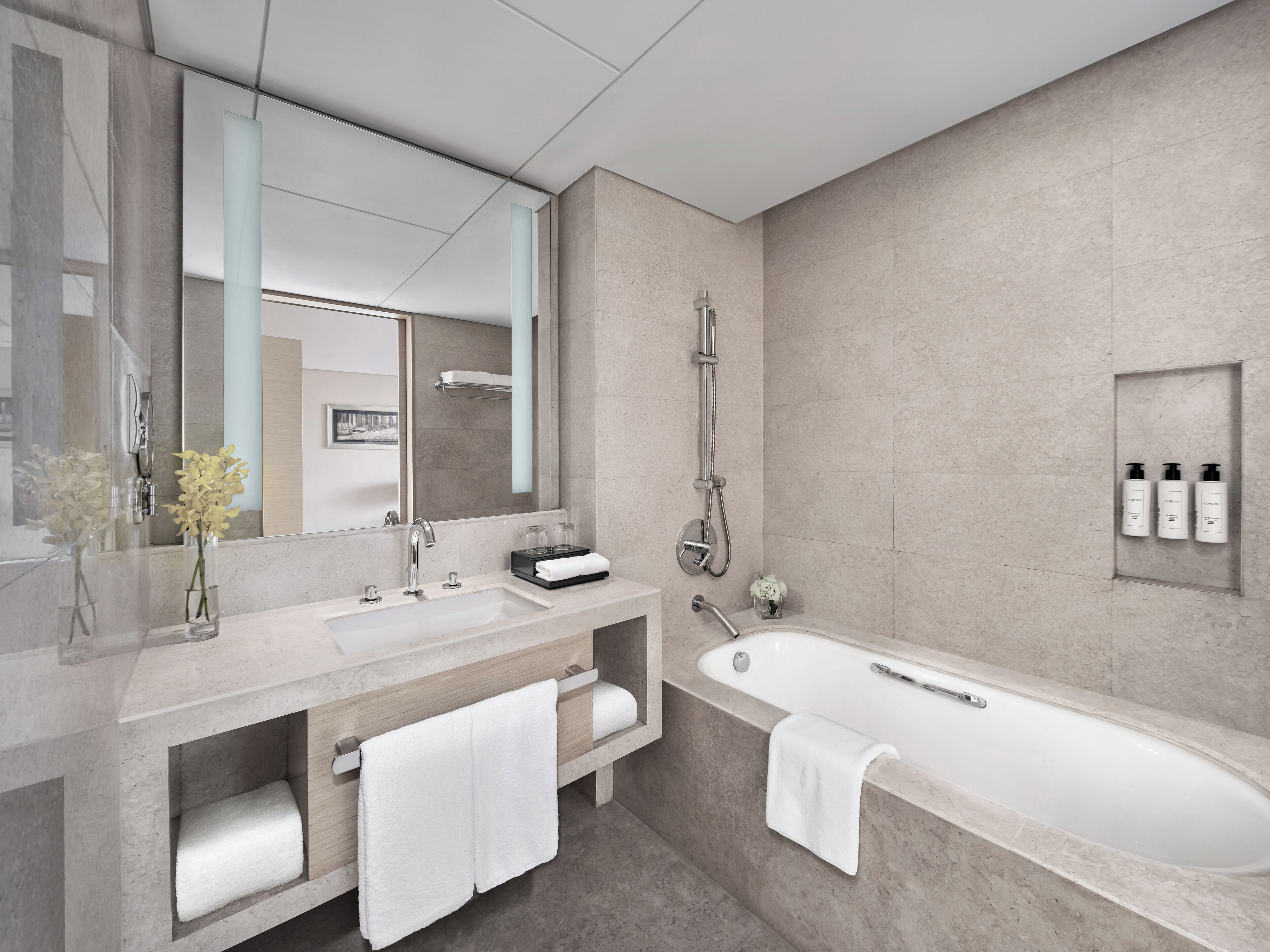 designer toiletries, hair dryer, bathrobes, slippers