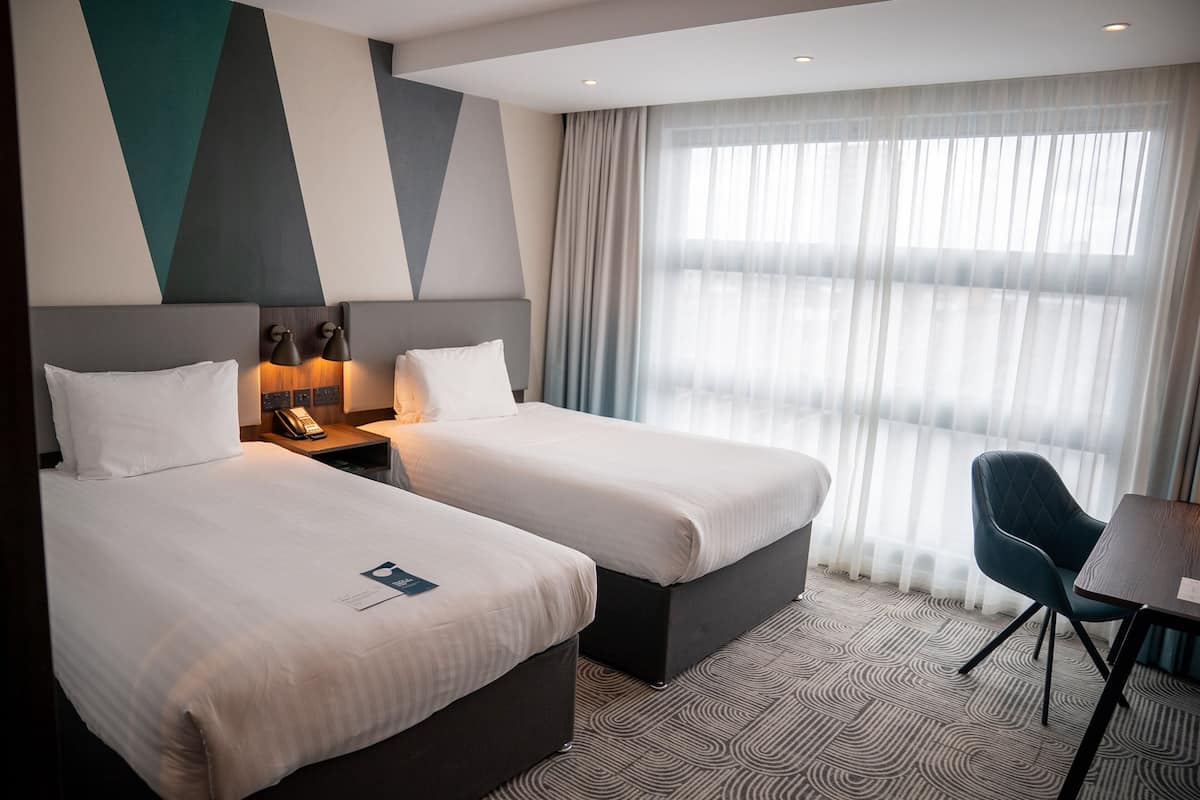 Hypo-allergenic bedding, in-room safe, desk, laptop workspace