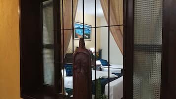 Standard Triple Room, Courtyard View | In-room safe, individually decorated, individually furnished, desk