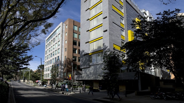 A multi-story building with a modern architectural design, featuring a mix of glass and concrete facades. - BOG Hotel  (Bogotá)