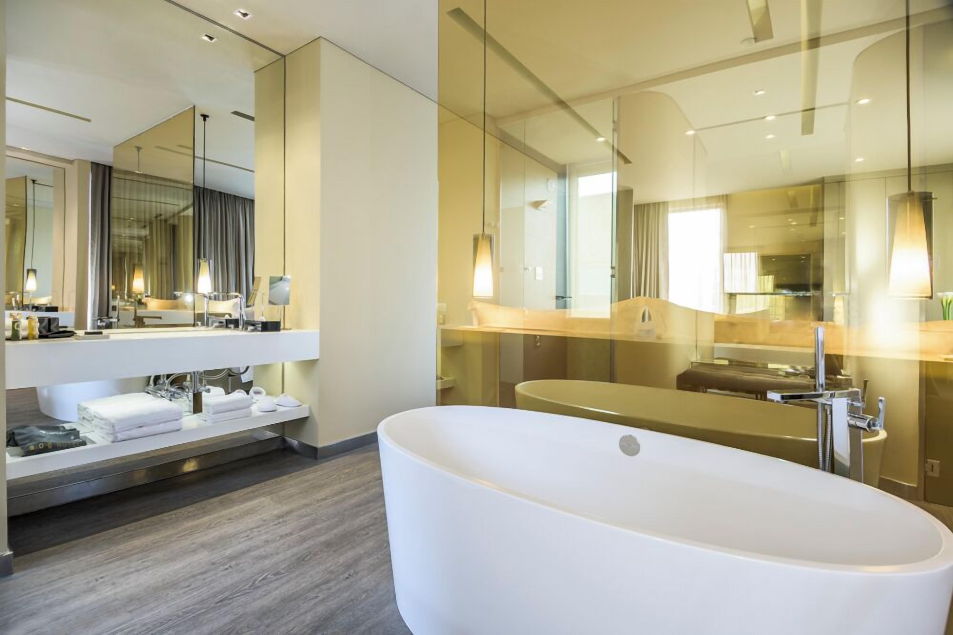 luxury suite | bathroom | shower, hydromassage showerhead, hair dryer, bathrobes