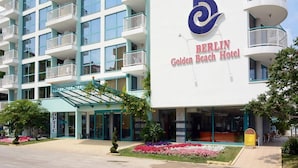 A multi-story hotel with balconies, a prominent logo, and a sign for the Berlin Golden Beach Hotel. - Berlin Golden Beach Hotel (Golden Sands)