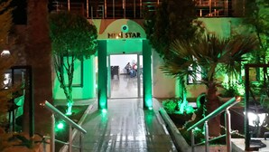 An outdoor entrance with a green archway labeled "Mini Star" leading to a building. - Ministar Hotel (Bodrum)