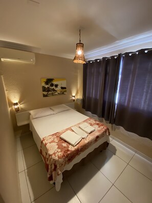 Standard Double Room | Minibar, individually decorated, desk, iron/ironing board