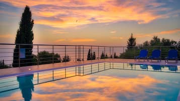 Seasonal outdoor pool, open 9:00 AM to 8:30 PM, pool umbrellas
