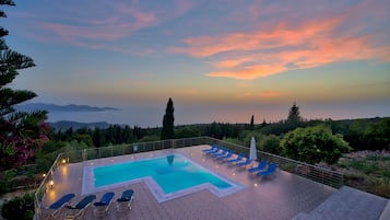 Seasonal outdoor pool, open 9:00 AM to 8:30 PM, pool umbrellas