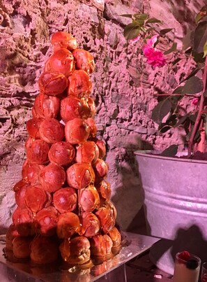 Indulge in a sweet treat atop a stylish surface, surrounded by lush greenery.