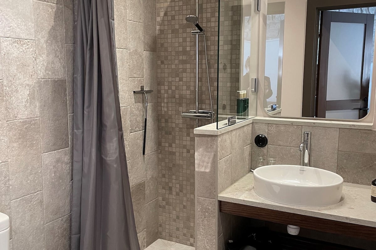 deluxe studio | bathroom | shower, designer toiletries, hair dryer, heated floors