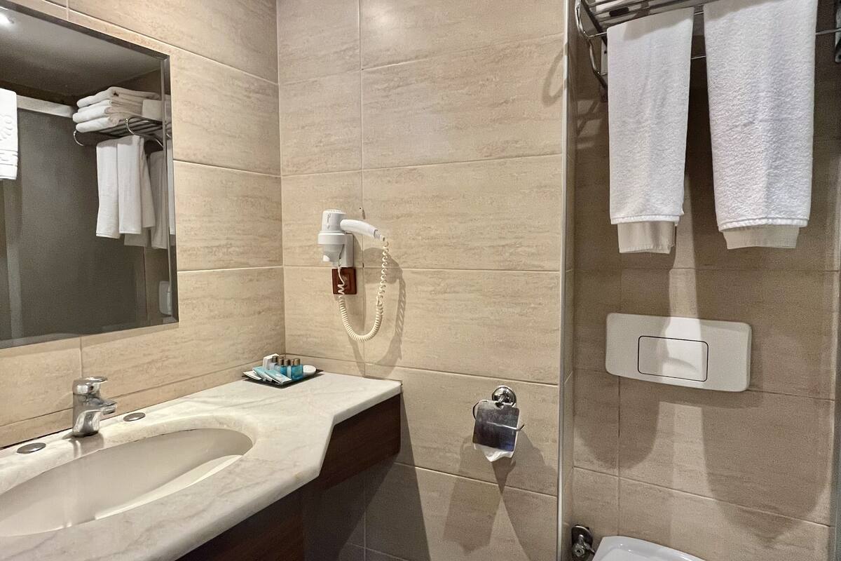 standard triple room | bathroom | hair dryer, towels